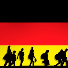 Flüchtlinge Symboldbild vor Deutschlandfarben